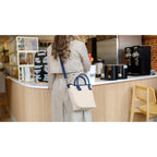 Navy Mini Market Street Crossbody Tote shown worn on a person
