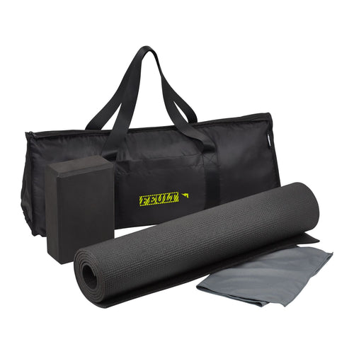 Black yoga mat with carrying strap and towel on a white background