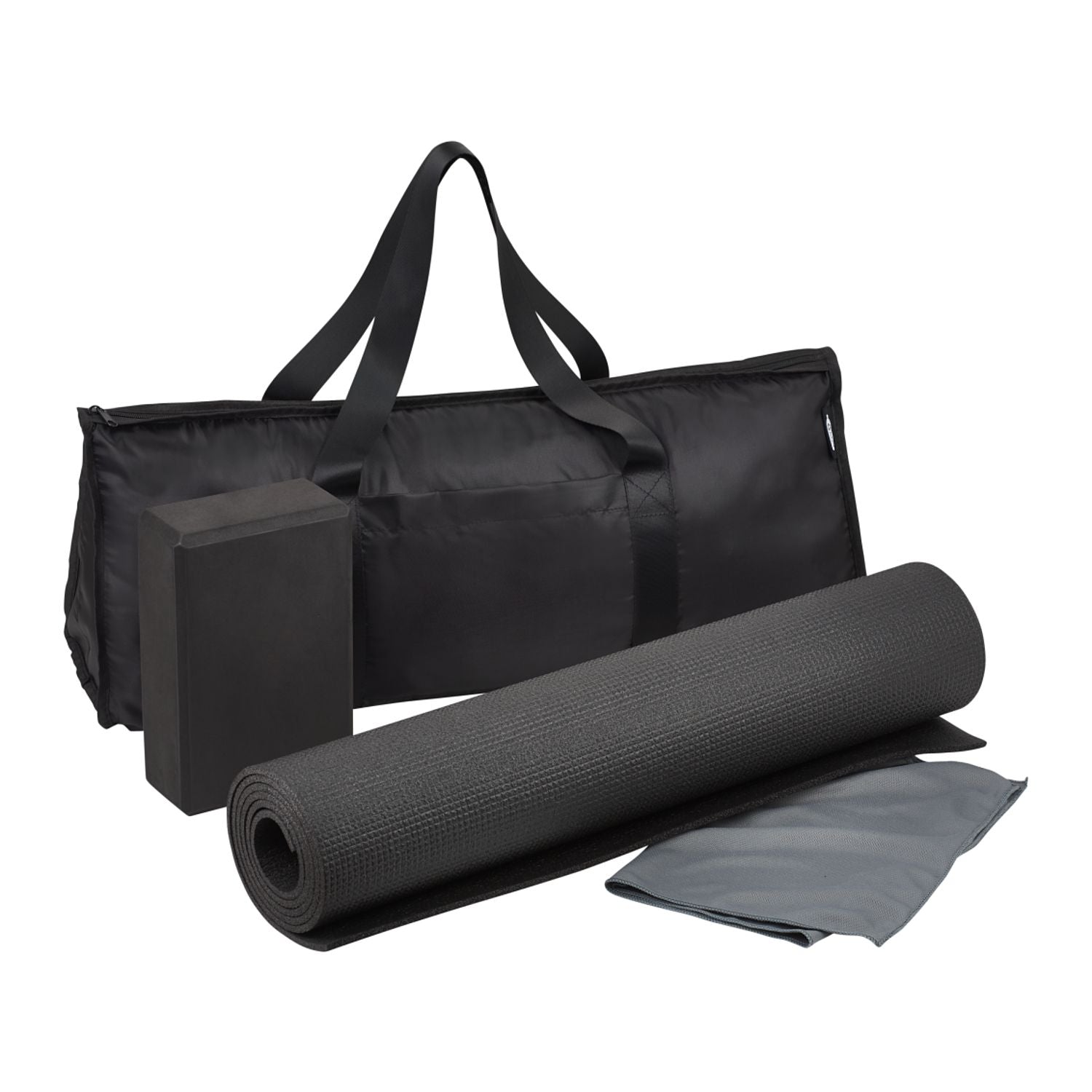 Black yoga mat, block, and towel with carrying bag on a white background