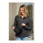 Woman shown wearing a Daybreak Travel Sling