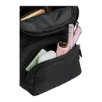 Daybreak Travel Sling shown with non included items inside of the front pocket