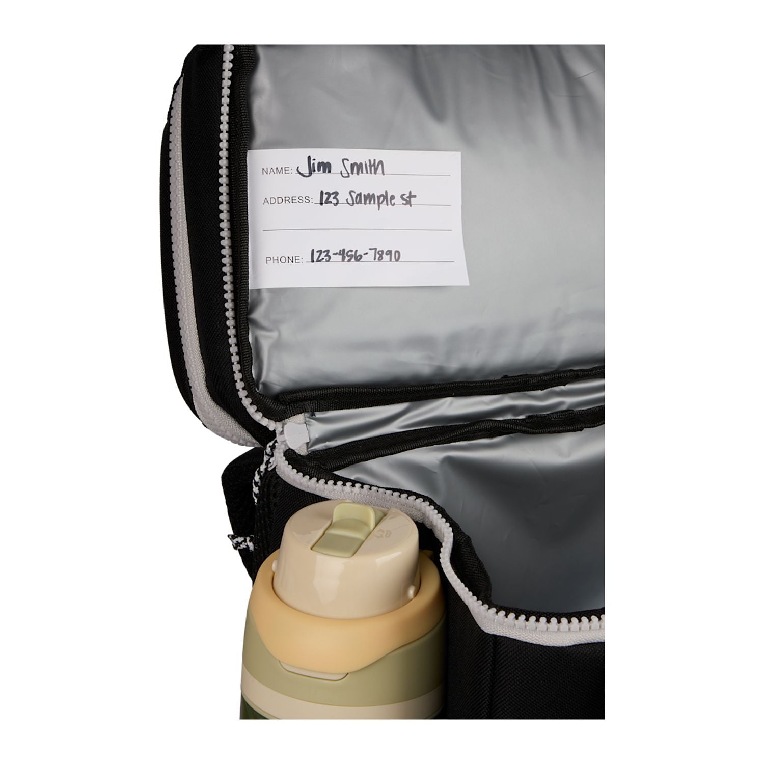 Black Glacial Recycled 15L Backpack Cooler shown opened and with a body in the holder