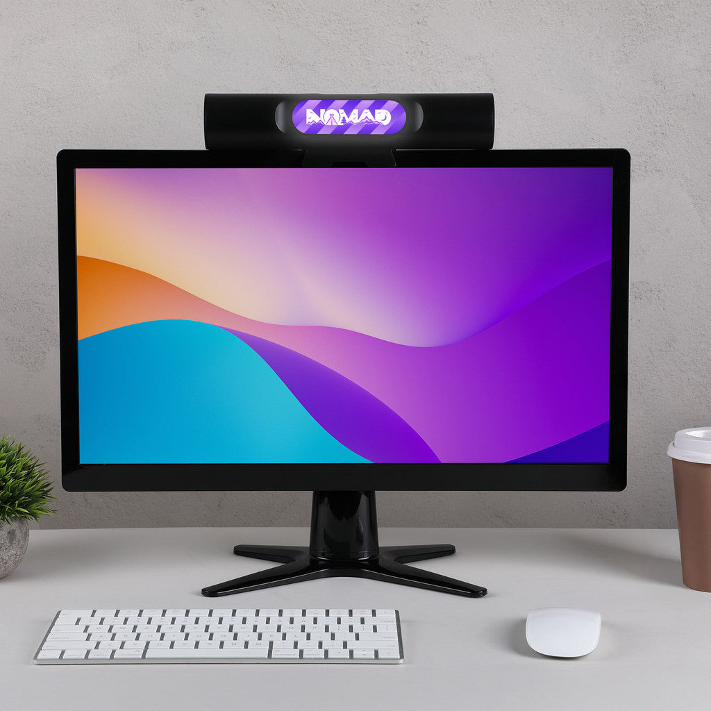 Sound Saber Clip On Wireless Monitor Speaker shown on top of a computer monitor