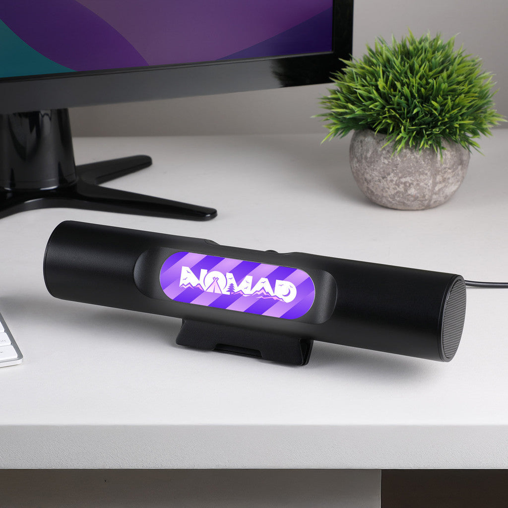 Sound Saber Clip On Wireless Monitor Speaker shown on a desk
