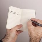 Open Flatmate Pocket Notebook shown in a person's hands