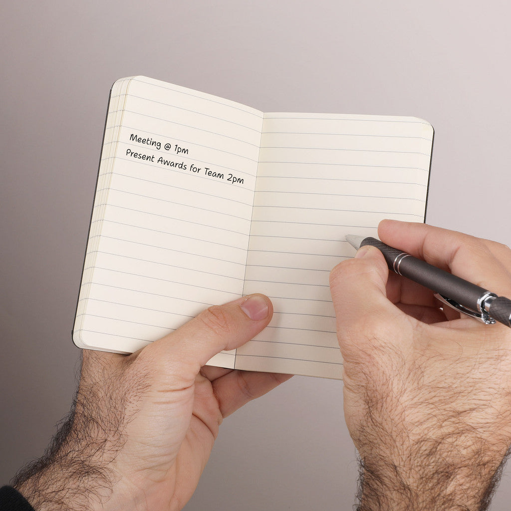 Open Flatmate Pocket Notebook shown in a person's hands