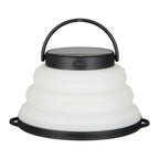 Collapsible white lantern with black handle on a white background