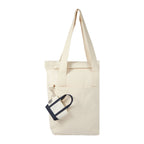 Navy Mini Tote Bag Charm shown attached to a tote bag 