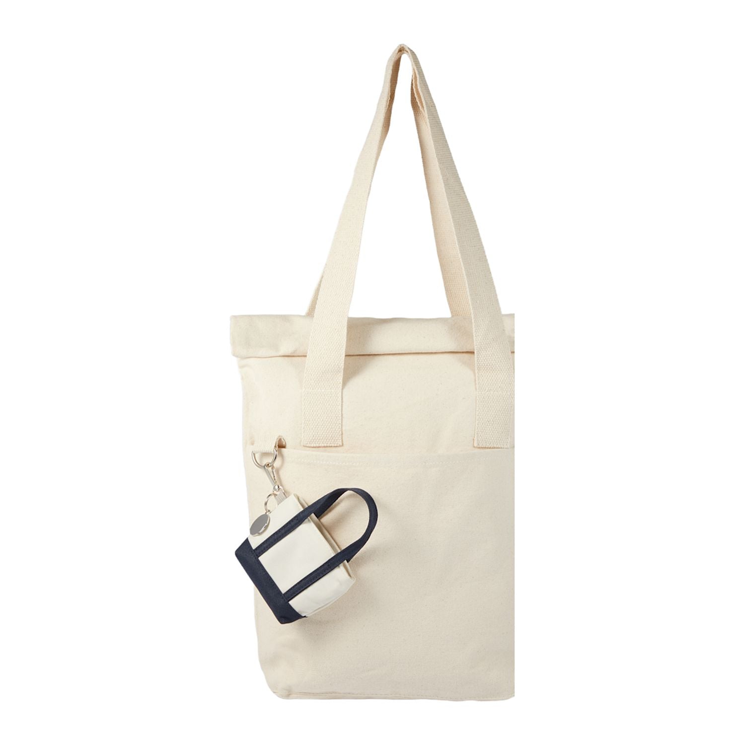 Navy Mini Tote Bag Charm shown attached to a tote bag 
