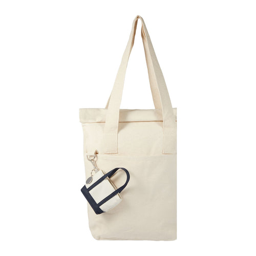 Navy Mini Tote Bag Charm shown attached to a tote bag 