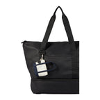 Navy Mini Tote Bag Charm shown attached to a tote bag 