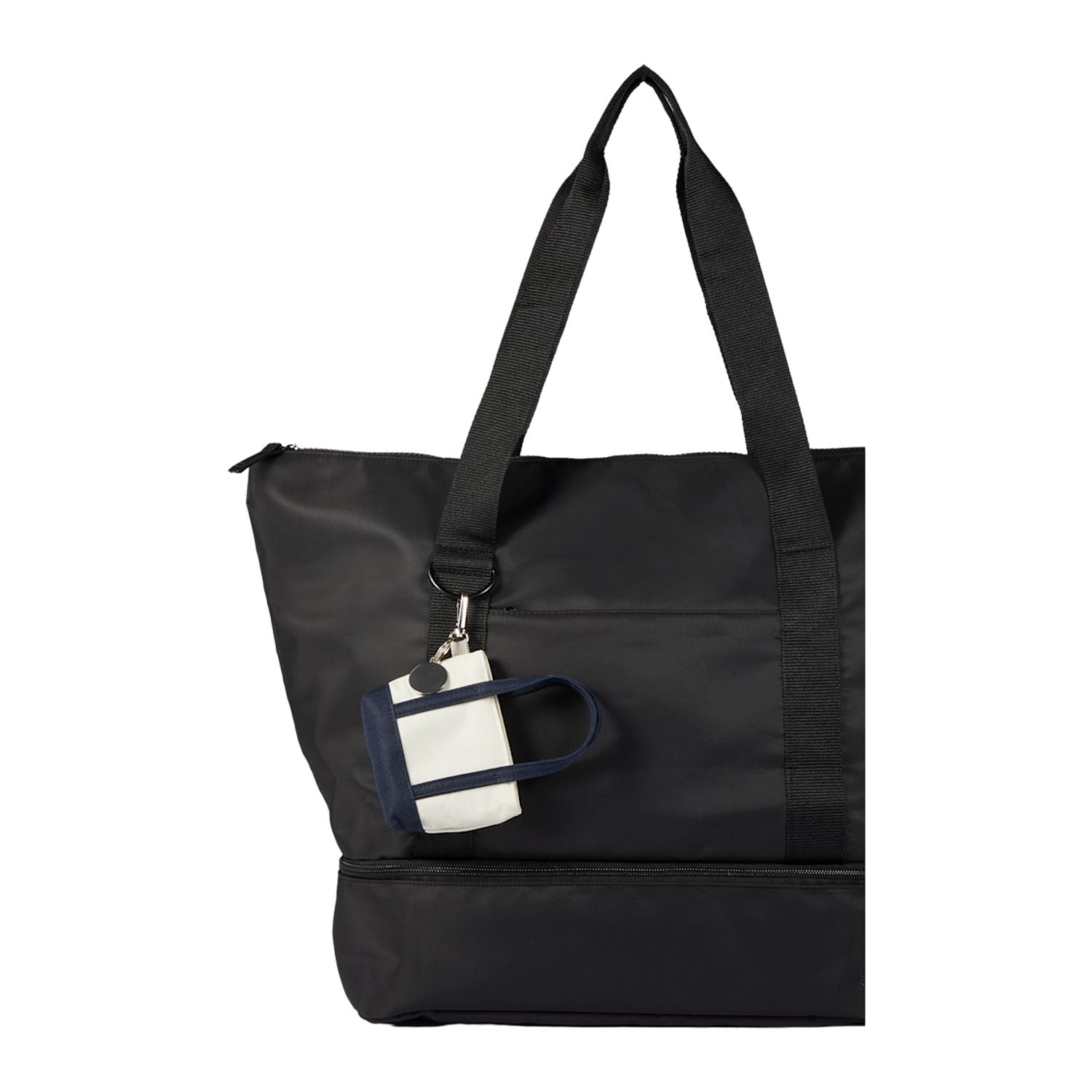 Navy Mini Tote Bag Charm shown attached to a tote bag 