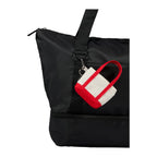 Red Mini Tote Bag Charm shown attached to a tote bag 
