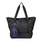 Navy Mini Daybreak Backpack Charm shown on a tote bag