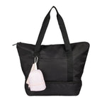 Pink Mini Daybreak Backpack Charm shown on a tote bag