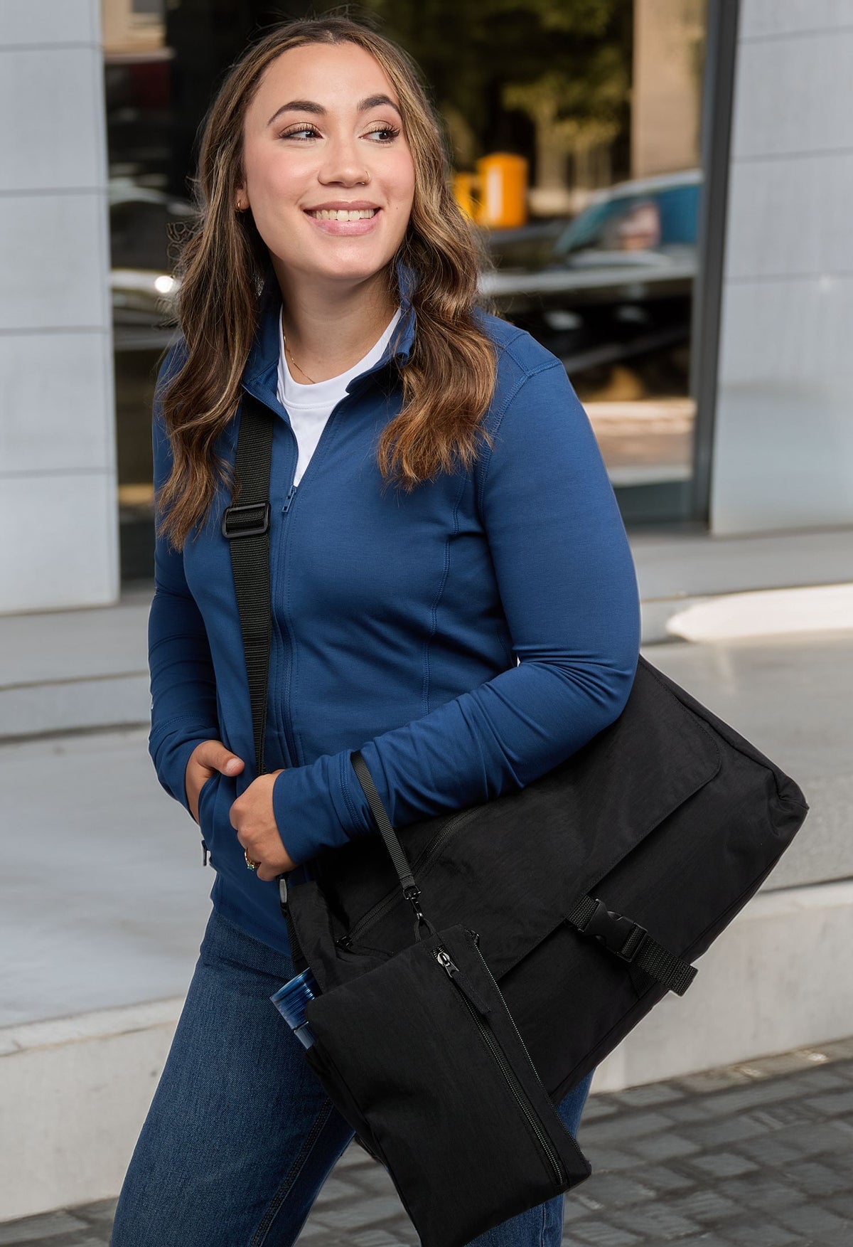 Person holding Avery 15" Computer Messenger Bag - Black