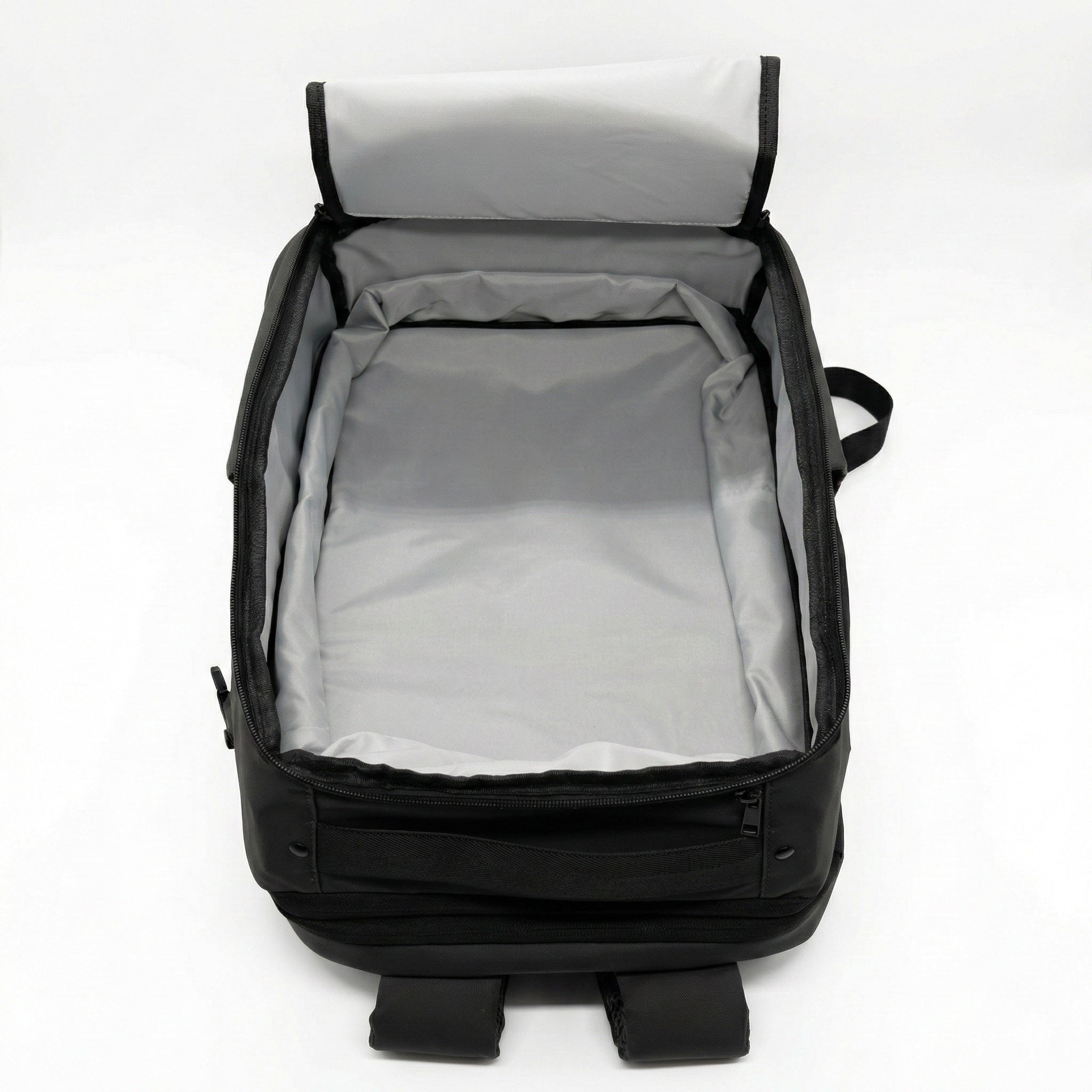 Black backpack with open lid on a white background