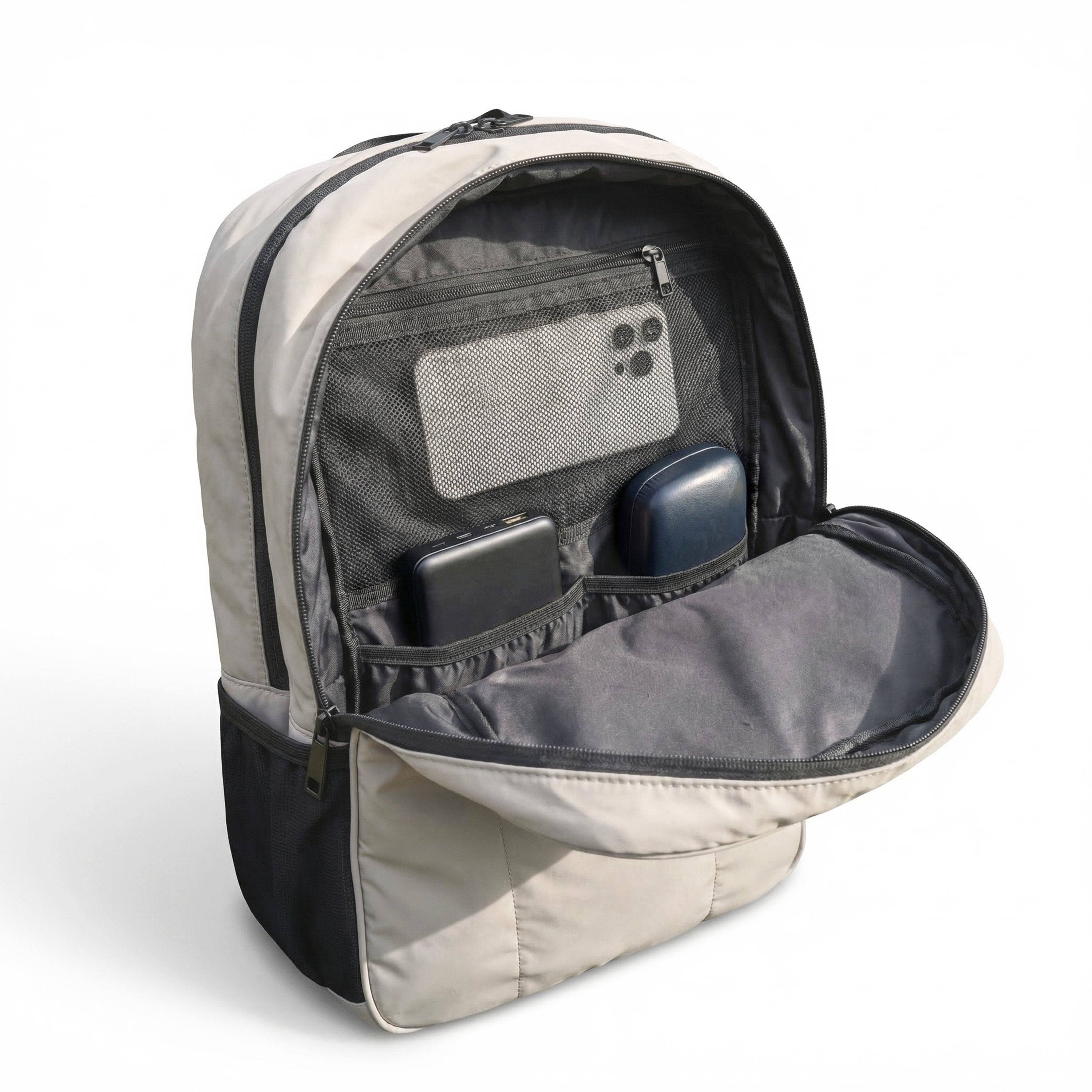 Open backpack showing compartments with electronic devices on a white background
