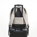 Backpack with a black suitcase on a white background