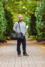 A person holding a Call of the Wild Drift Duffle