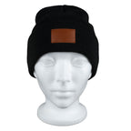 Black Tiburon Knit Cuffed Beanie with Patch shown on a manikin 