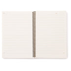 Open notebook with spiral binding on a white background