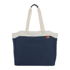Navy tote bag with white handles on a white background