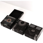 Black packaging boxes with audio cassette design on a white background