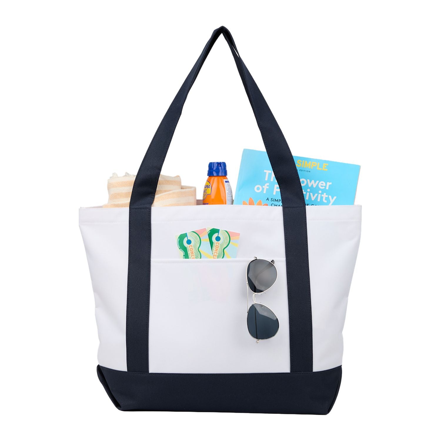 Tote bag with black straps containing items on a white background