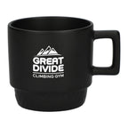 Black mug with 'Great Divide Climbing Gym' logo on a white background