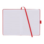Open notebook with red binding and strap on a white background