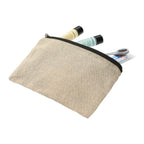 Natural colored pouch with black zipper containing a bottle, tube, and brush on a white background. Does not include items