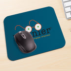 Blue mouse pad with a graphic of glasses and text, featuring a computer mouse on a desk.