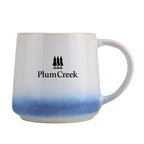 A Mug with blue gradient at the base and custom logo on a white background