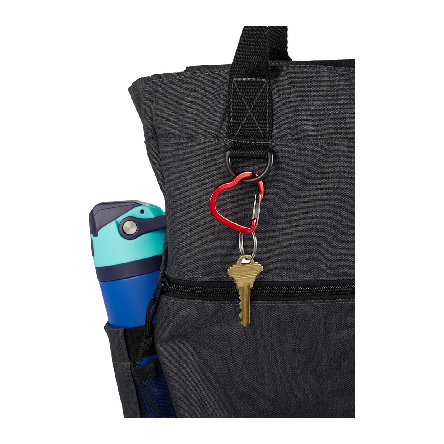 Black tote bag with a key and colorful mug attached, on a white background