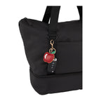 Apple Leather Keychain shown on a tote bag