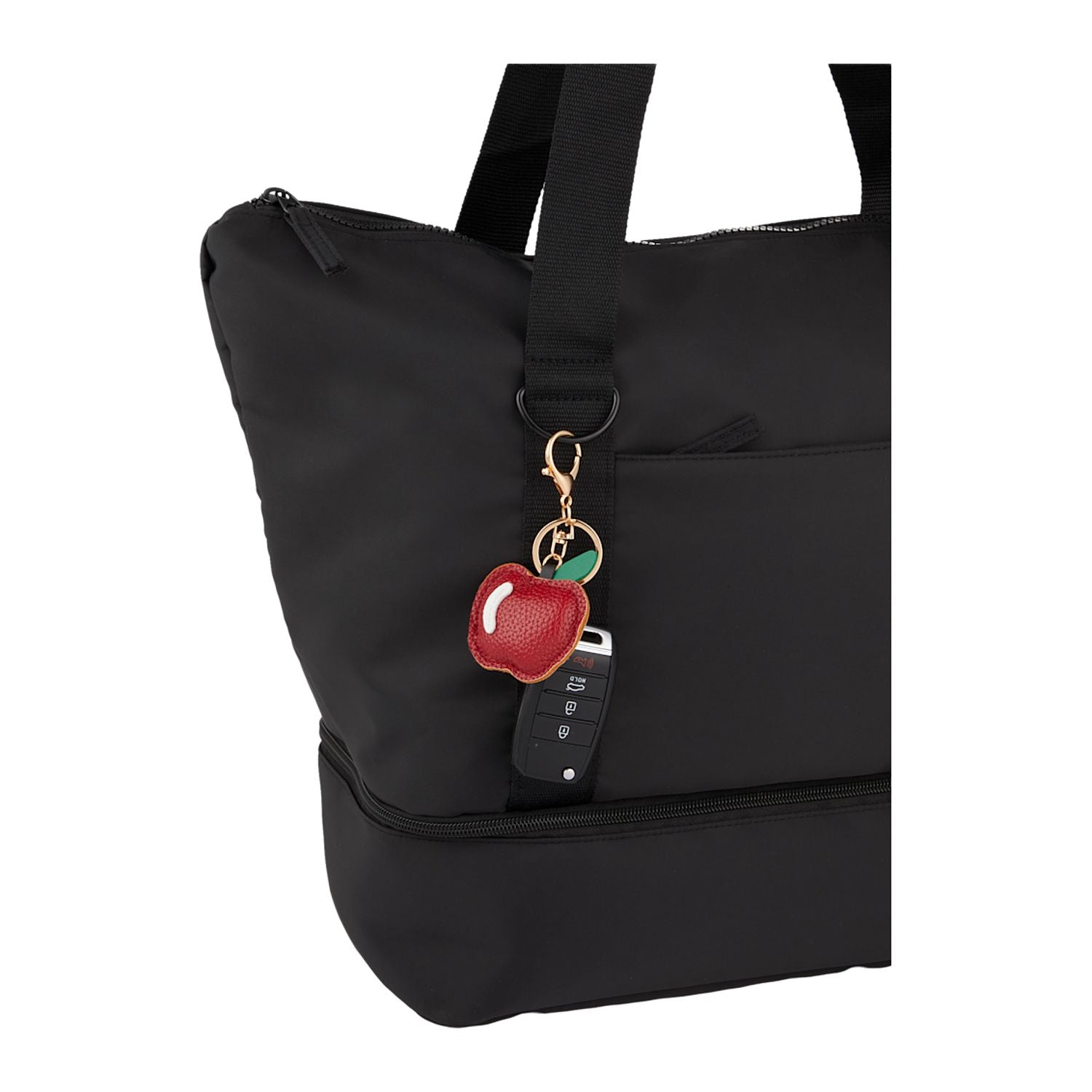 Apple Leather Keychain shown on a tote bag