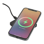 Smartphone with wireless charging pad and charging cable on a white background