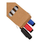 Set of markers in a cardboard holder on a white background