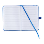 An open lined notebook with a blue hard cover and a matching blue ribbon bookmark, photographed on a plain white background.