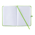 An open lined notebook with a bright green cover and matching green ribbon bookmark, photographed on a plain white background.