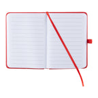 An open lined notebook with a red cover and matching red ribbon bookmark, photographed on a plain white background.