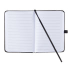 An open lined notebook with a black cover, white pages, and a black ribbon bookmark, shown on a plain white background.