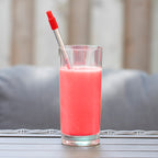 Red 8" Reusable Stainless Steel Straw shown inside of a beverage