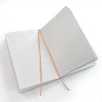 Inside of notebook. Lined Paper and bookmark ribbon