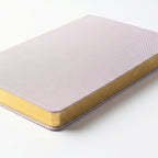 Notebook shown closed with pages showing the color of the binding