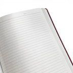Open notebook with lined pages on a white background