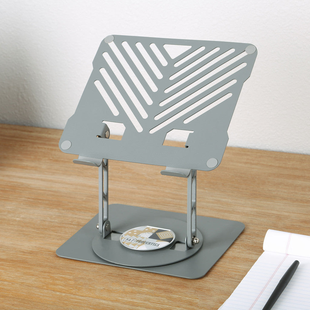 Gray adjustable laptop stand on a wooden surface with a white background