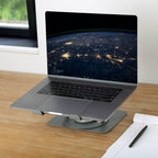 Laptop on a stand with Earth view wallpaper on a wooden desk