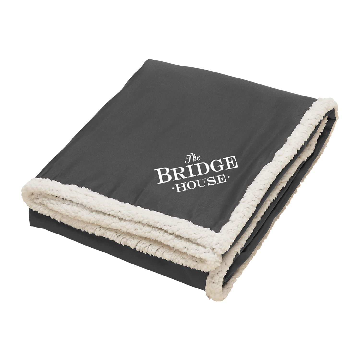 Black blanket with white trim and 'The Bridge House' text on a white background